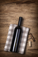 Red wine bottle and corkscrew