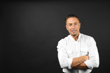 Fototapeta premium Handsome man on black background