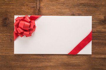  Envelope with decorative red ribbon and bow 