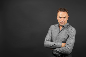 Handsome man on black background