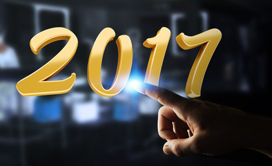 Businessman touching 2017 3D rendering text