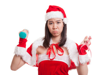 Asian Christmas Santa Claus girl with measuring tape and dumbbel