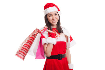 Asian Christmas Santa Claus girl with shopping bags.