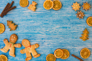 Christmas background with festive decorations on blue wooden background with copy space