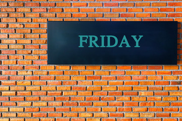 Fototapeta premium Friday letters on a black background with brick wall