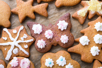 Colorful Christmas gingerbread cookies on  baking paper
