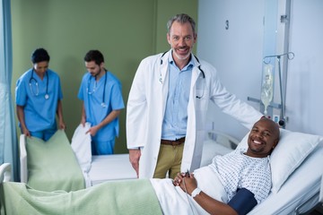 Fototapeta premium Portrait of doctor and patient in ward