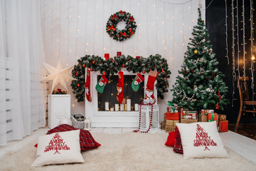 Interior room with elegant Christmas tree and fireplace