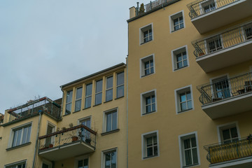 big and yellow facaded apartment houses