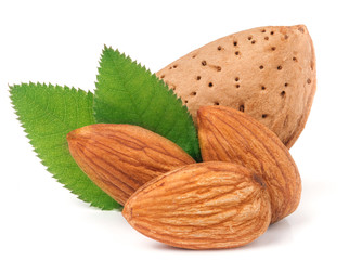 almonds in their skins and peeled with leaf isolated on white background