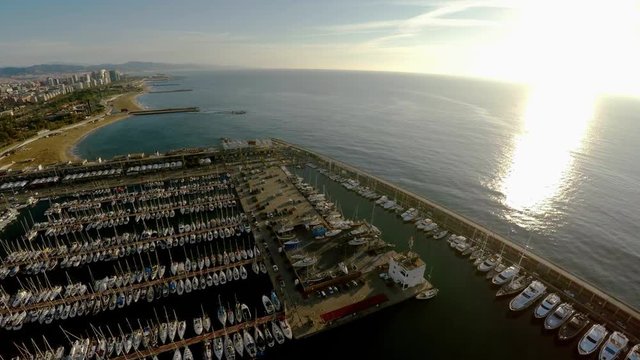 Aerial view. Berth yacht and boats off the coast of Barcelona. Spain. ProRes. 4K.
