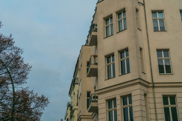corner house on a autumn day with trees on the left