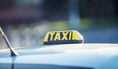 Taxi car waiting passengers in town.Taxi light on the cab of the car ready to transport the...