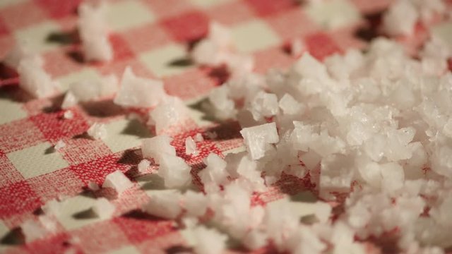 Sea slat on a checkered kitchen table with red and white