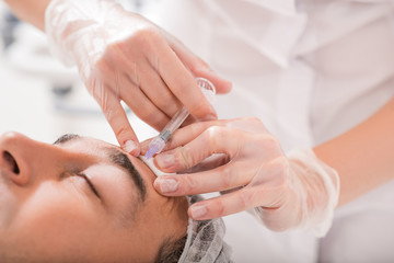 Professional doctor getting rid of human wrinkles