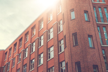 Obraz premium old industrial brick building in sunlight