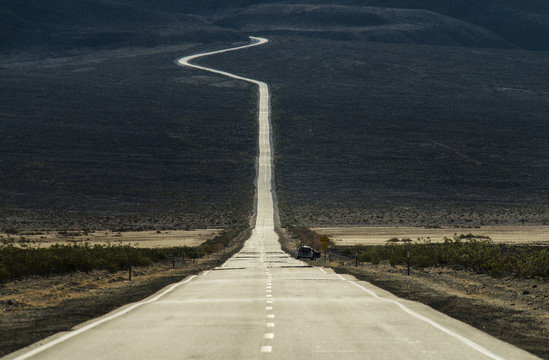 Empty road passing through Death Valley National Park