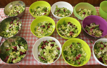 bowls of lettuce and salad in the canteen