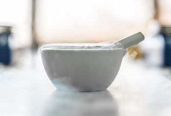 Laboratory experiment with liquid nitrogen in laboratory mortar