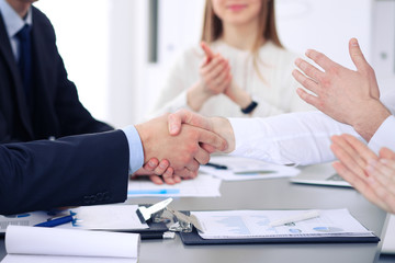 Close up of  two business man shaking hands to each other finishing up the meeting