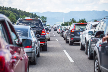 Traffic jam on the highway in the summer holiday period or in a traffic accident. Slow or bad...