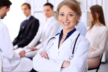 Happy doctor woman with  patients