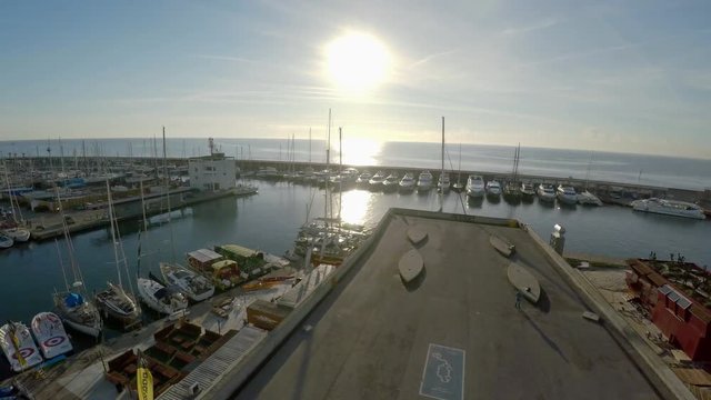 Aerial view. Berth yacht and boats off the coast of Barcelona. Spain. ProRes. 4K.
