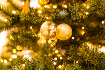 Obraz na płótnie Canvas high colored golden christmas decoration at christmas tree