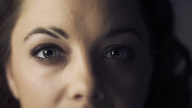woman zoom in opening eyes