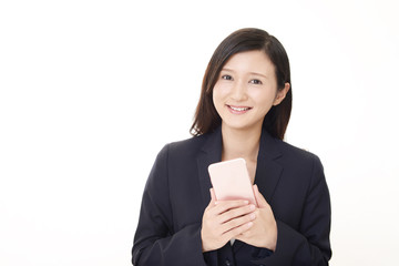 スマートフォンを持つビジネスウーマン