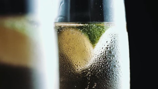 Glasses filled with champ with a piece of lime