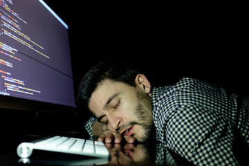 Freelancer programmer falling his face down taking a nap