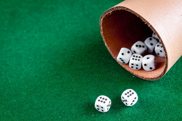 playing poker dice on green background