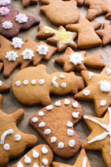 Colorful Christmas gingerbread cookies on  baking paper