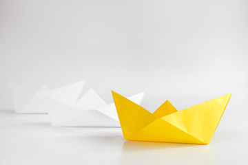 choice concept paper boats on white background