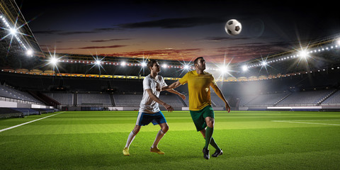 Soccer players fighting for ball . Mixed media
