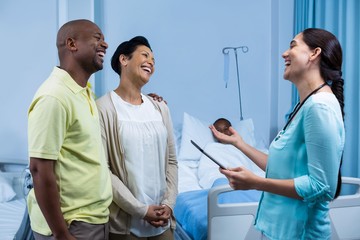 Doctor interacting with patient parents