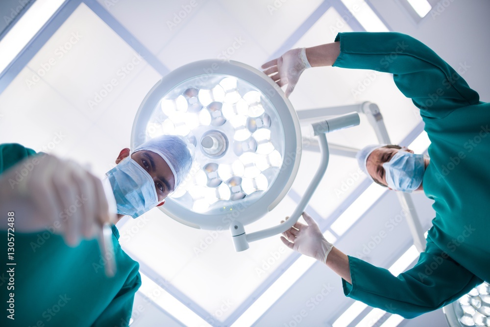 Poster surgeons operating in operation theater