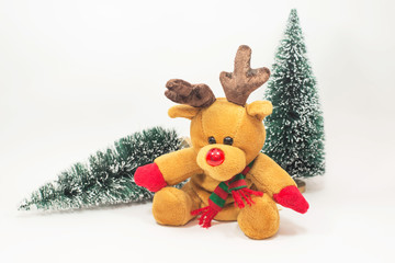 Reindeer doll with Christmas tree on white background.