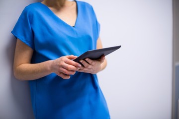 Doctor using digital tablet in hospital