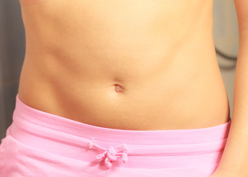 Slim fit female belly, perfect abdomen muscles.
