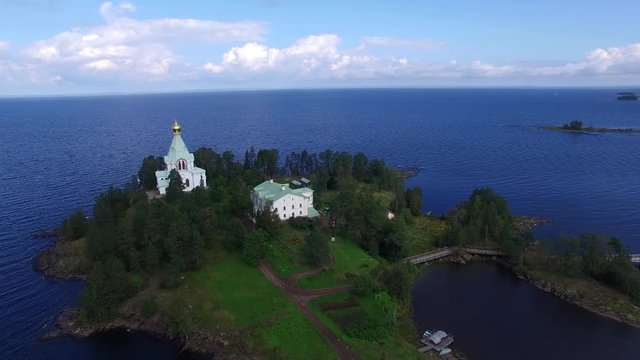 Flying  over Nikolsky Skete. The landscape of the island of Valaam.  The journey to the holy places. Aerial view.