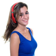 Teenage girl listening to music on wireless headphones - Isolated on white