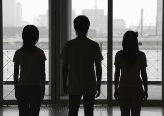 Silhouette of three people