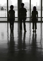 Silhouette of three young people