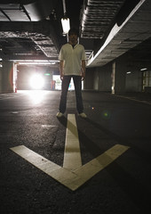 Man and arrow marking in parking lot