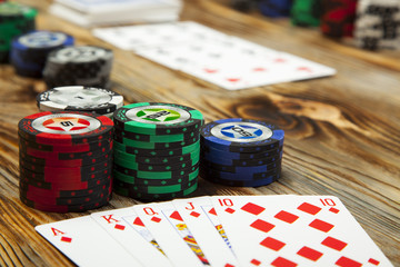 Combination of card game poker on the old wooden table
