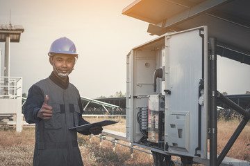 engineer showing thumbs up at solar power plant;feeling to goal of great performance energy
