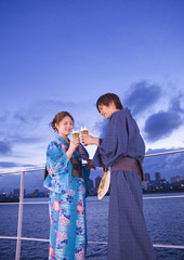 Couple in yukatas toasting