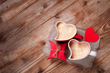 two cups coffee cappuccino gift box wooden table. Mug in shape of heart